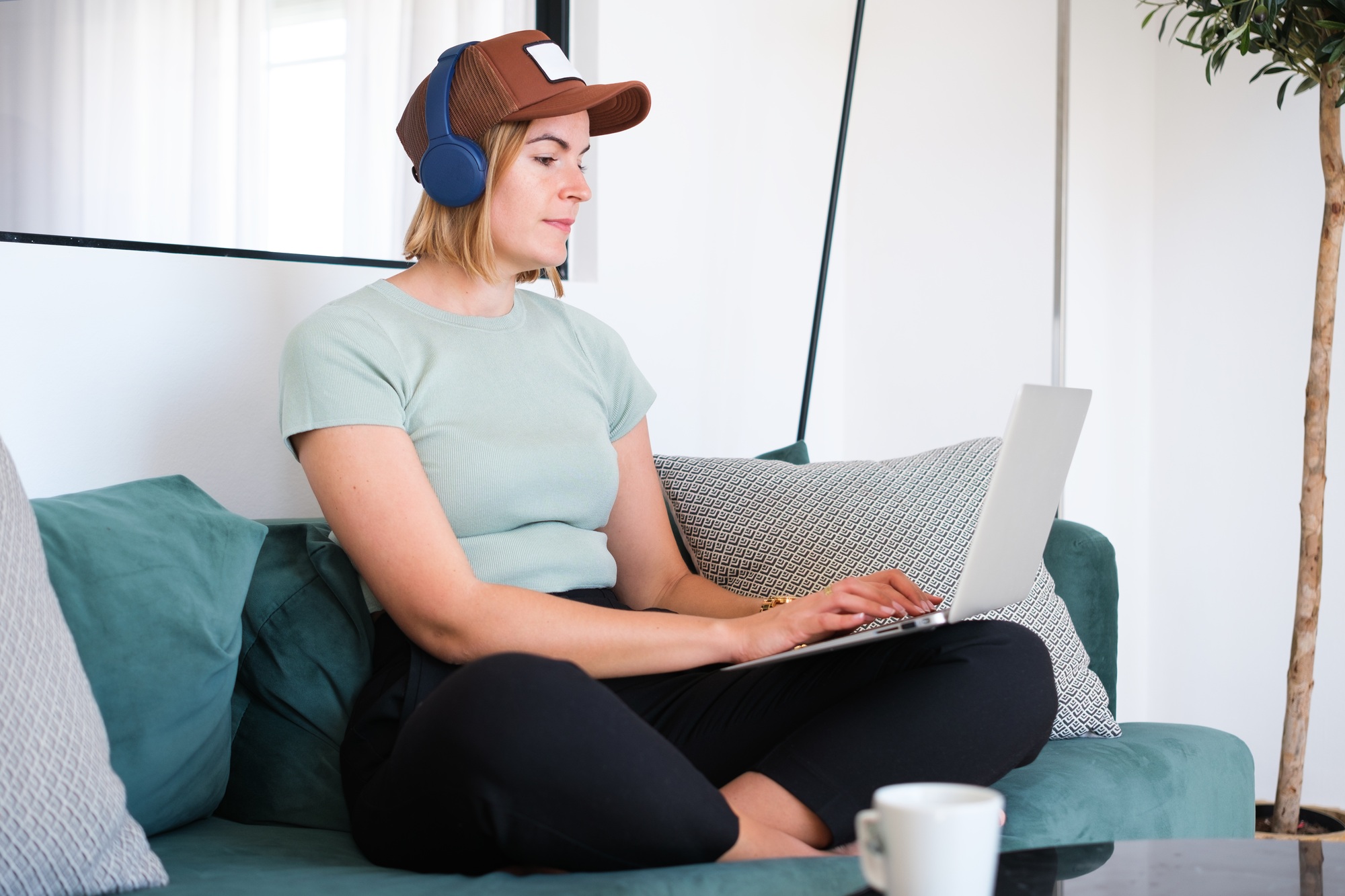 Young digital nomad woman using the laptop to create content from anywhere in the world.